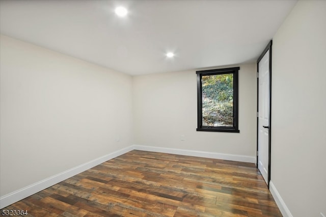 spare room featuring dark hardwood / wood-style floors