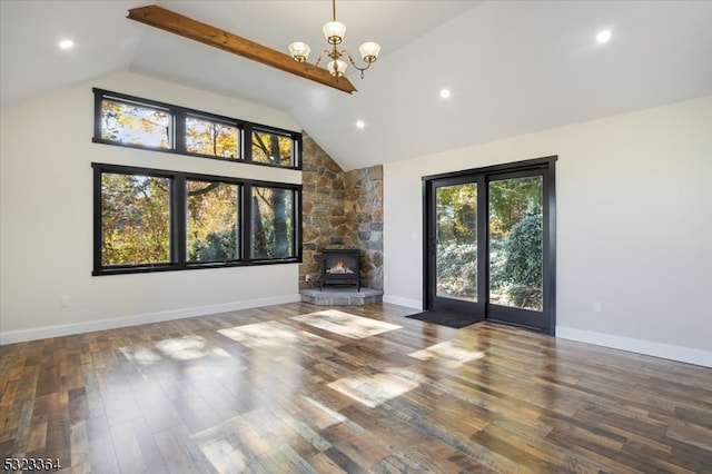 unfurnished living room featuring dark hardwood / wood-style flooring, a wood stove, a chandelier, high vaulted ceiling, and beamed ceiling