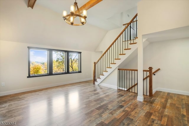 interior space featuring dark wood-type flooring, beamed ceiling, and high vaulted ceiling