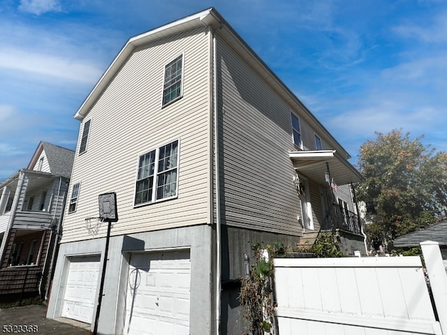 view of property exterior featuring a garage