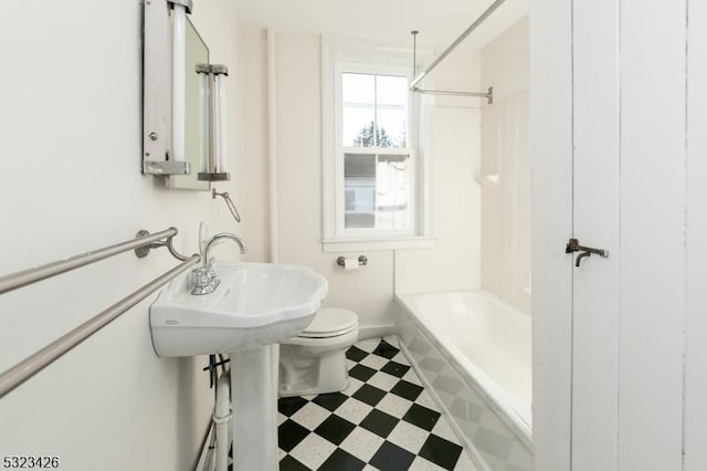 full bathroom with bathtub / shower combination, toilet, and sink