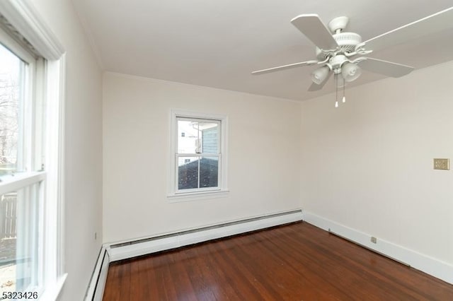 unfurnished room with plenty of natural light, ceiling fan, baseboard heating, and dark wood-type flooring