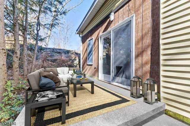 view of property exterior with a patio and an outdoor hangout area