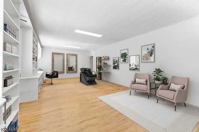 living area featuring hardwood / wood-style floors and a textured ceiling