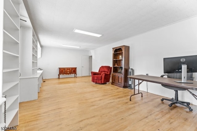 office with a textured ceiling and hardwood / wood-style flooring