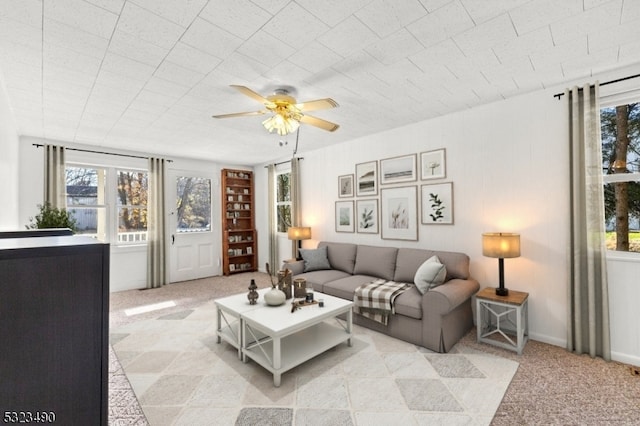 living room with ceiling fan and light carpet