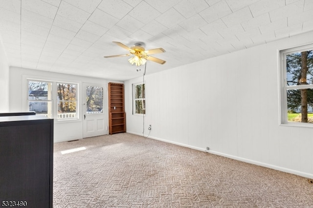 interior space featuring ceiling fan