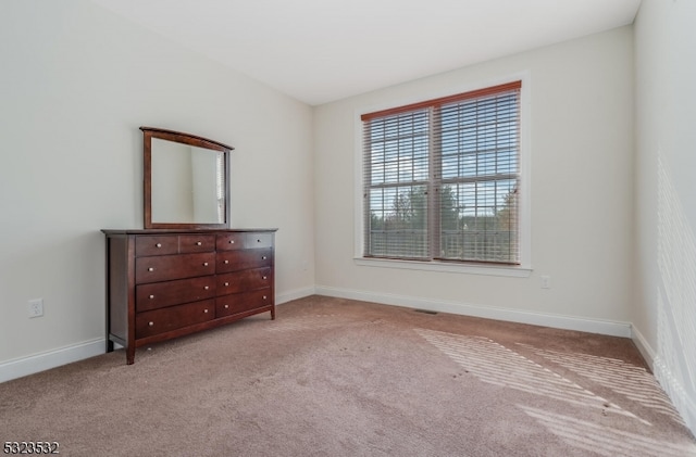 unfurnished bedroom with light carpet