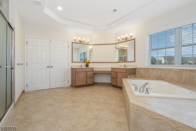 bathroom with vanity, a raised ceiling, ornamental molding, and separate shower and tub