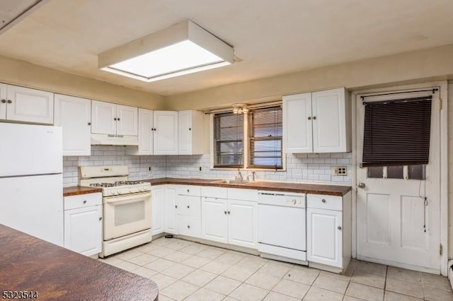 kitchen featuring white cabinets, white appliances, sink, and tasteful backsplash