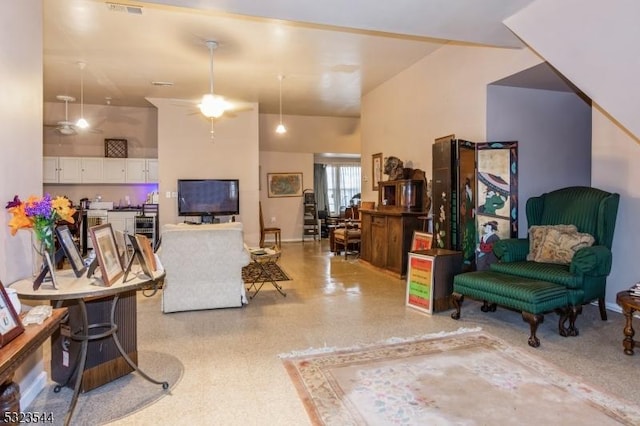 living room with a high ceiling