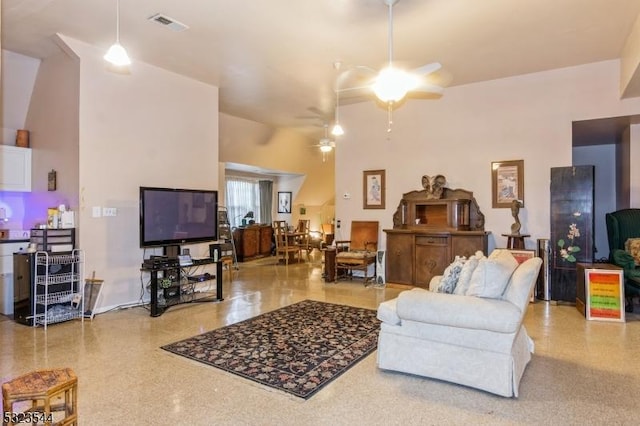 living room featuring a high ceiling and ceiling fan