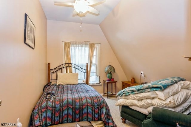 bedroom with carpet floors, ceiling fan, and lofted ceiling