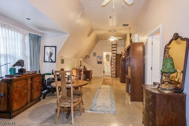 interior space featuring ceiling fan and vaulted ceiling