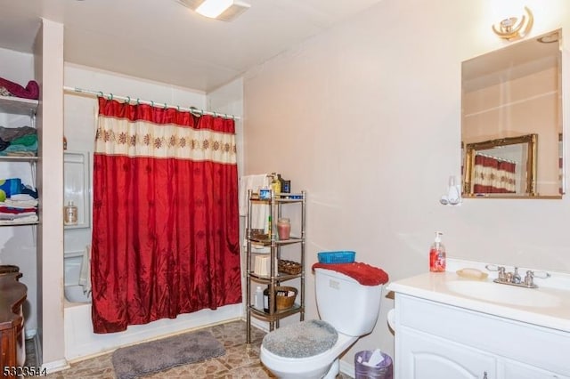 full bathroom with shower / bath combo, vanity, and toilet