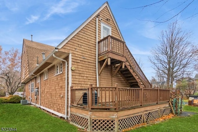 view of property exterior featuring a lawn, central air condition unit, and a deck