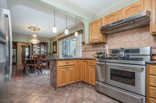 kitchen with tile patterned floors, pendant lighting, appliances with stainless steel finishes, and ornamental molding