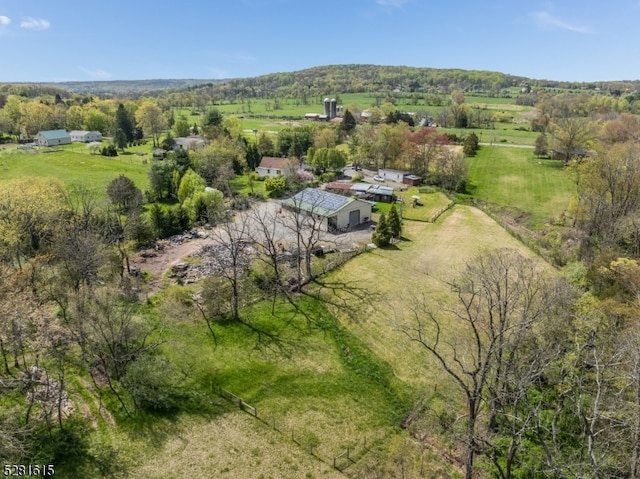 birds eye view of property featuring a rural view