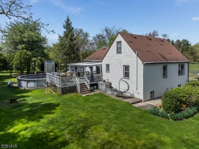 back of house featuring a yard