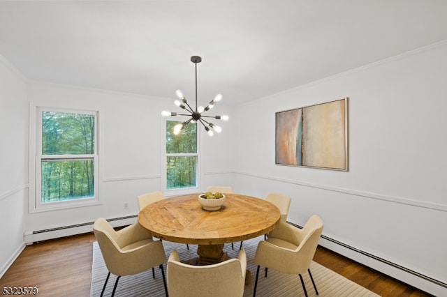 dining space with baseboard heating, plenty of natural light, and wood-type flooring