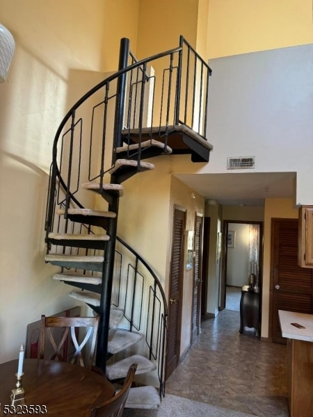 stairs with a towering ceiling