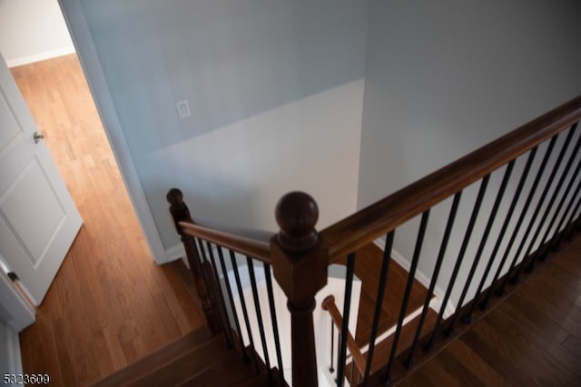 stairs with wood-type flooring