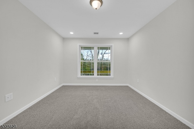 empty room with carpet flooring