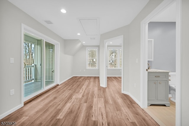 interior space featuring plenty of natural light and light hardwood / wood-style floors