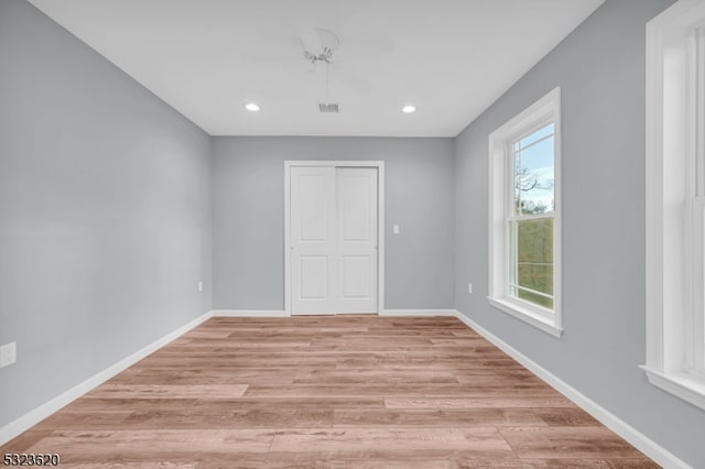 spare room featuring light wood-type flooring