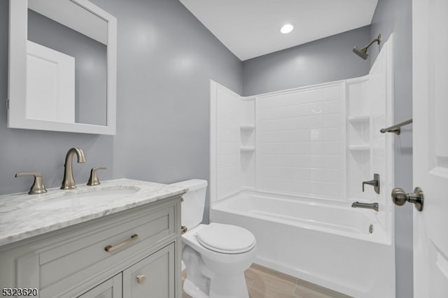 full bathroom featuring vanity, shower / bath combination, and toilet