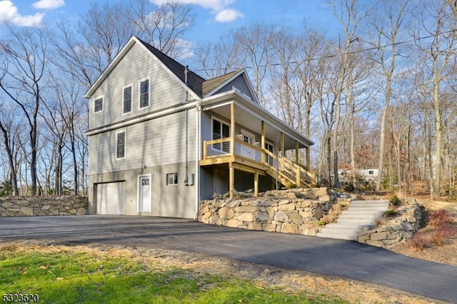 view of property exterior with a garage