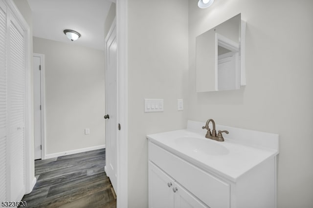 bathroom featuring hardwood / wood-style flooring and vanity