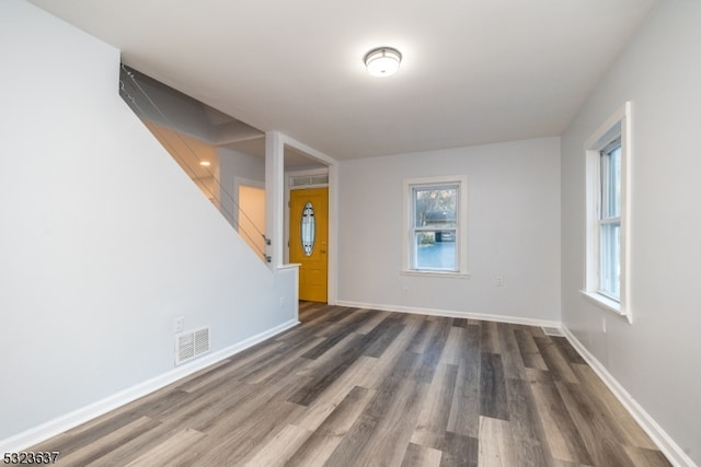 spare room featuring dark hardwood / wood-style flooring