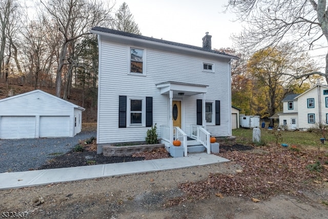 view of front of home featuring an outbuilding and a garage