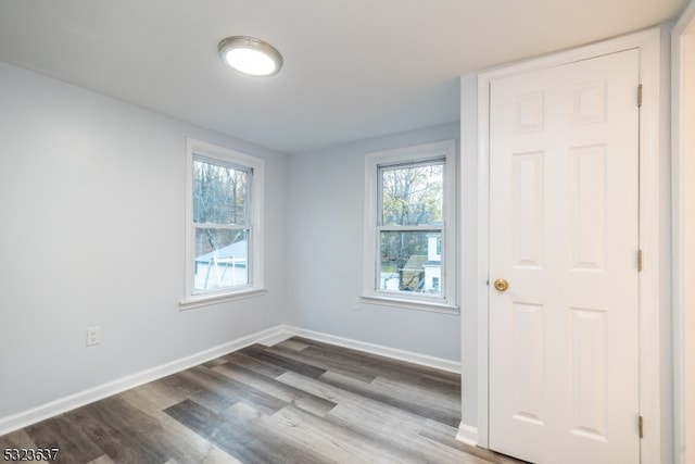 unfurnished room featuring wood-type flooring