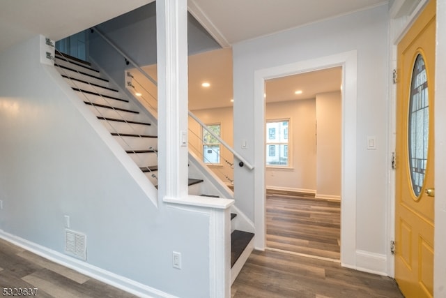 staircase with hardwood / wood-style floors