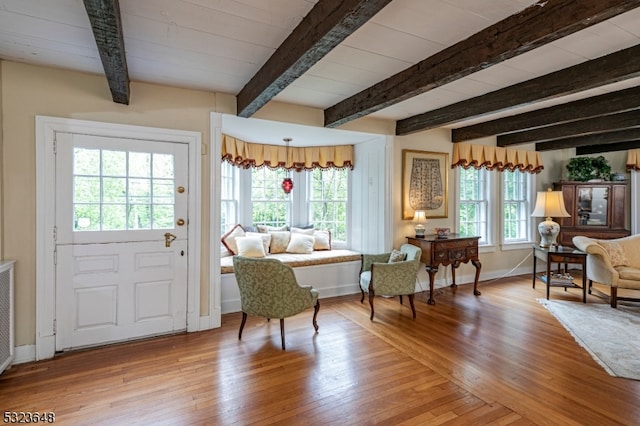 foyer with hardwood / wood-style floors and beam ceiling