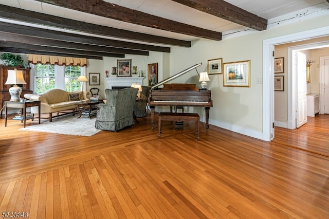 interior space featuring hardwood / wood-style floors and beam ceiling