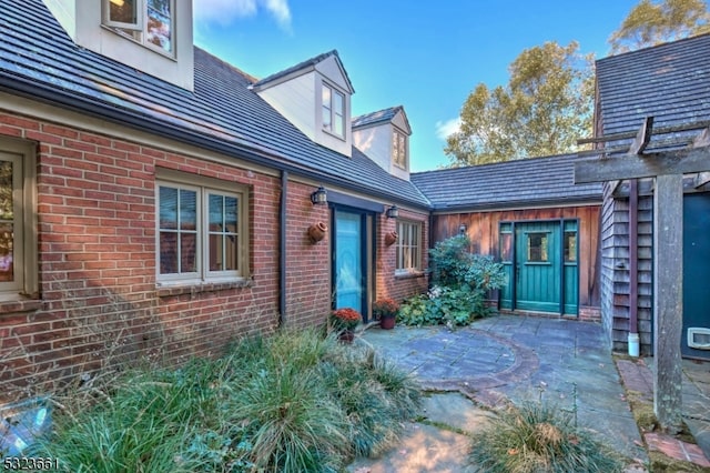 property entrance with a patio