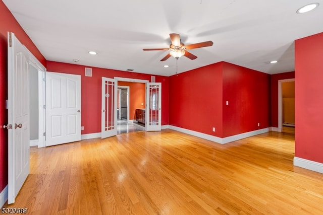 unfurnished living room featuring french doors, wood-type flooring, and ceiling fan