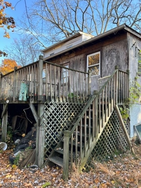 view of home's exterior with a wooden deck