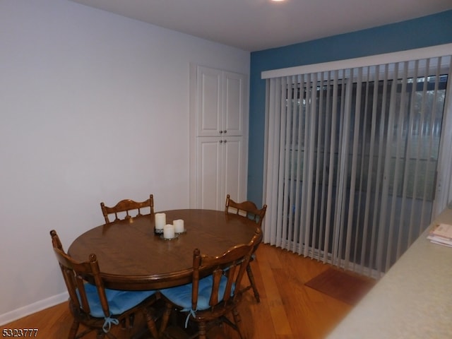 dining area featuring light wood-type flooring