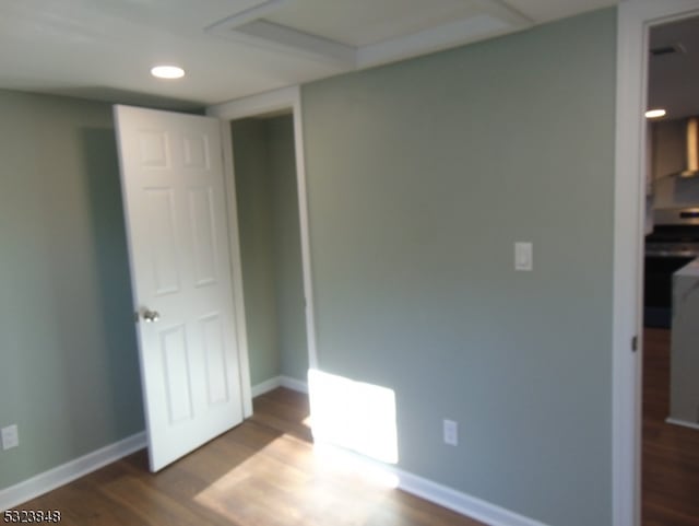 unfurnished bedroom featuring dark wood-type flooring