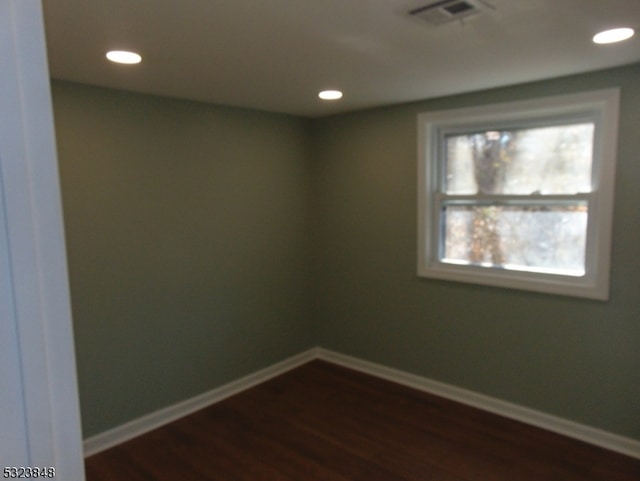 empty room featuring dark hardwood / wood-style floors