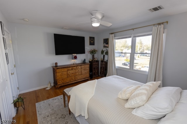 bedroom with hardwood / wood-style flooring and ceiling fan