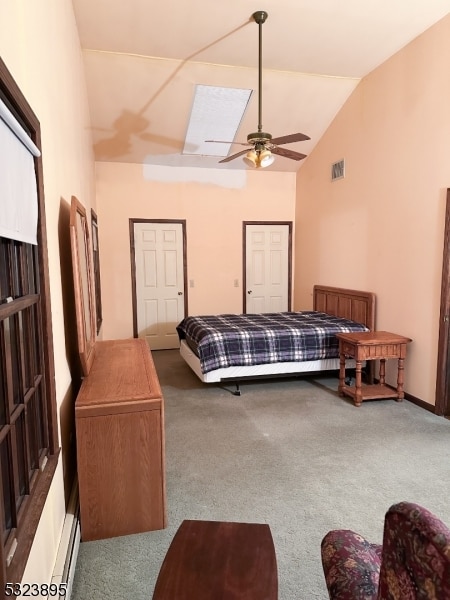 carpeted bedroom featuring ceiling fan, a baseboard radiator, and lofted ceiling