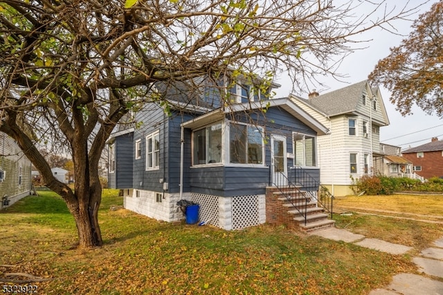 bungalow with a front yard