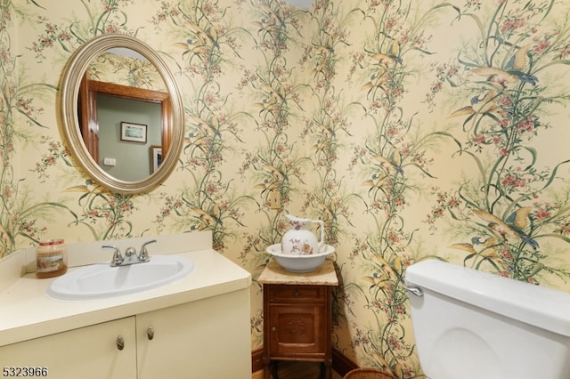 bathroom with vanity and toilet