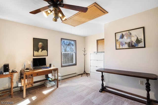 carpeted office with ceiling fan and a baseboard radiator