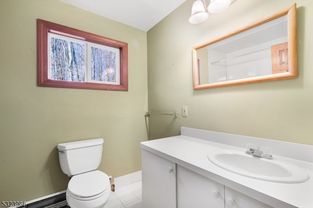 bathroom featuring tile patterned floors, vanity, and toilet